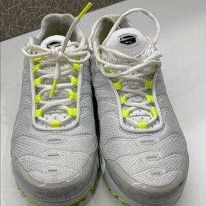 Nike White and Neon Yellow Sneakers

I wear a 7.5 and they fit me well.